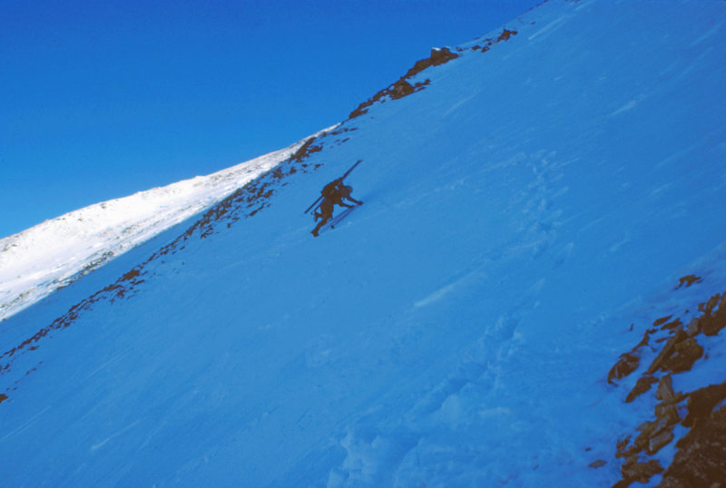 Wendy Weiss kicking steps in windboard while traversing the Continental Divide from Stanley Mtn to Vasquez Pk. Near Berthoud Pass. CO. January 1986