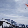 Paraglider with Palymra Pk (13k') in the back at Telluride Ski Resort