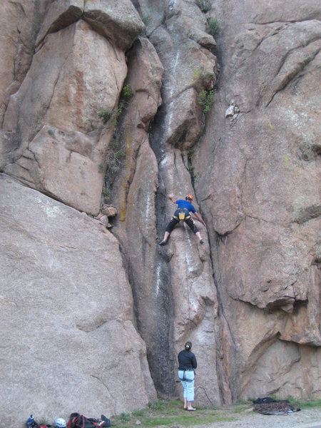 Tom Woods on the slabby arete at the start. Lora Woods belaying.
