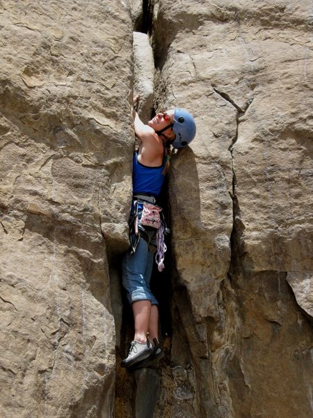 Juile on the crux section of Warm up Crack.