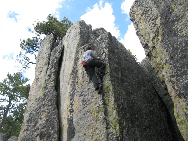 Johnny Walker was the first of us to do this with a rope about 10 years ago. He called it 5.9. I guess that would make it v0 as a boulder, but I don't really know boulder grades