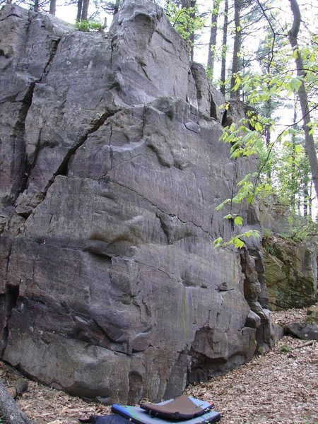 Climb up through face into slopers.