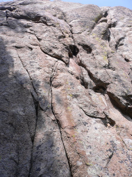 Jaguary: straight up the crack system<br>
Jagged Ascension (12): follow bolts just to the left.