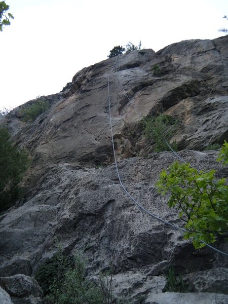 Road Runner (5.9) climbs the steep face left of the ropes.