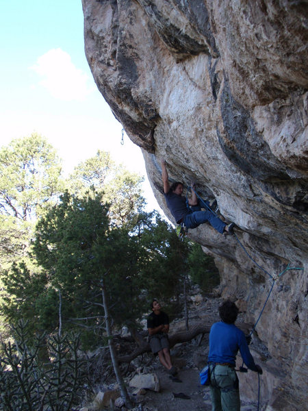 Matt L. trying the move off of the flared finger lock. It tends to feel OK until you bring your feet up.<br>
<br>
The green sling is a thread that provides a nice directional to keep the rope out of the climbers way. Double shoulder length runner.