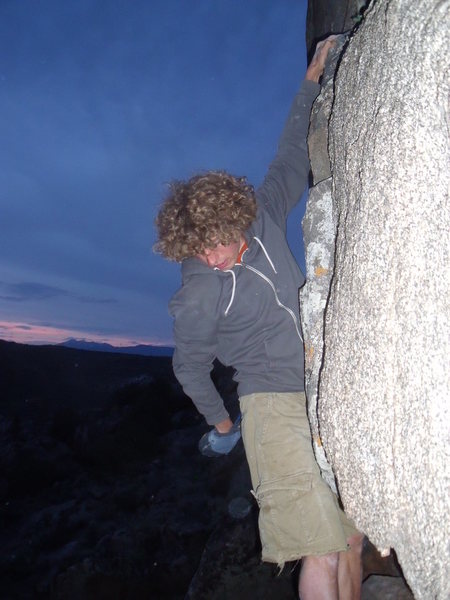 Adam seshing the Grey Lightning boulder.