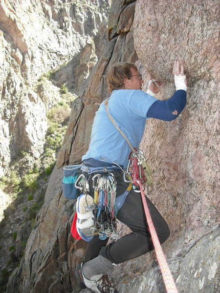 Starting the crux pitch.