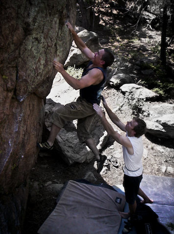Jim Hausmann climbing "Block Head (V3). The Block Head boulder. Three Sister Park, Colorado.