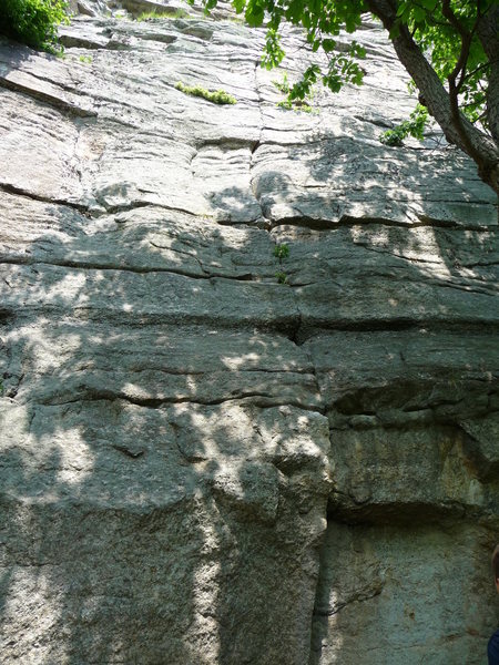 Blistered Toe. <br>
<br>
The right-facing corner below the crack is the direct start (5.9+(+)). The usual creaky-flake start is just to the left of the photo, and traverses in over the direct start.