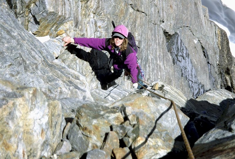 Sue, learning on the fly to rock climb with crampons