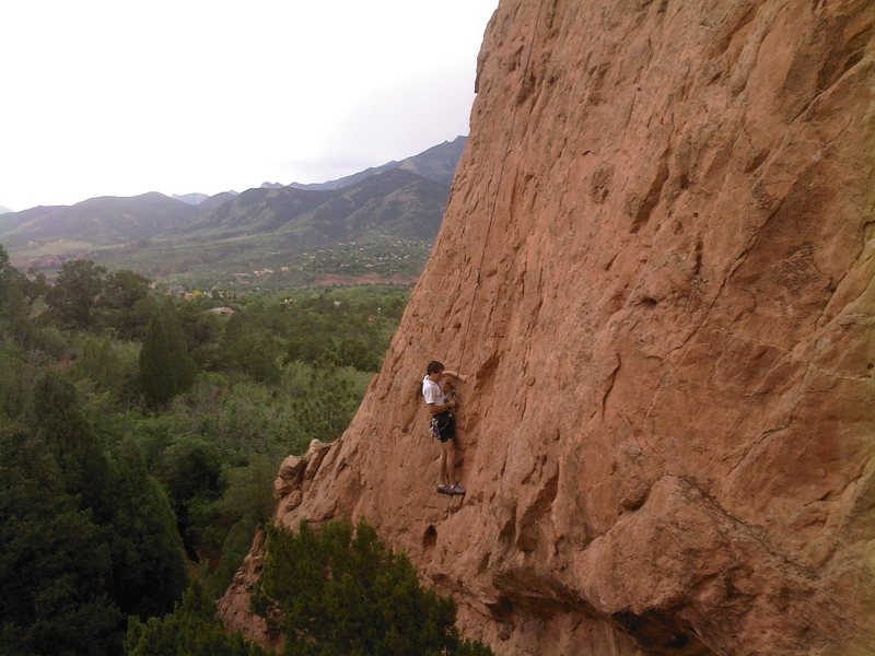 This is the lower part of the route. It actually starts about 25-30 feet below the climber, just left of the scrub oaks at the base.