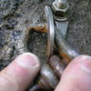 Corroded anchor at second belay of Mercy Me, June 5, 2005. All the anchors have this little problem to some degree.  Easy to replace, if you know ahead of time.  Bring some quick links and a wrench, if your interested.