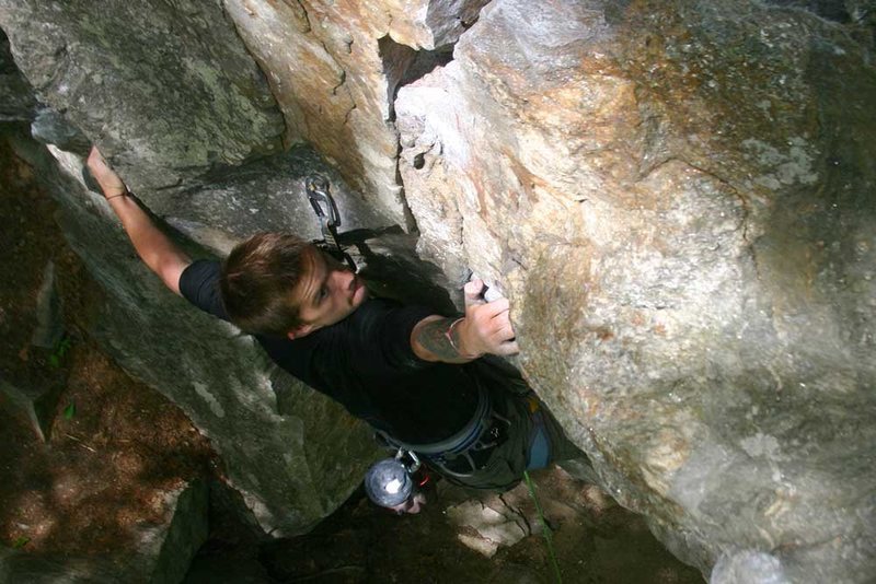 mike spanning the crux on Scene of the Crime...