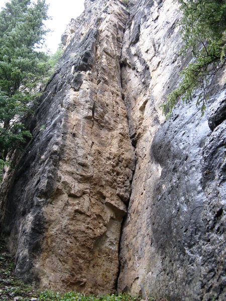 The Bone Crack 5.8 on the far left side of Sunshine way past the Thunderhead. Overhanging right facing open book with finger to hand sized gear. As you can see in the photo it stays dry in the rain. Done earlier this decade ground up to two bolt anchor.