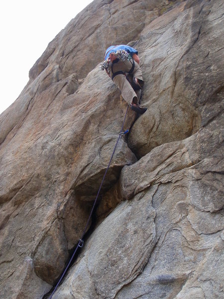 Ben on the flake leading up to the big right angling dihedral/roof