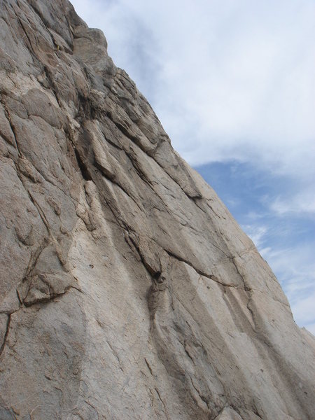 Chivas Regal follows the left-facing edge in the center of the picture, up to the left. The closest bolt in the frame is shared with Neil's not Young Anymore (5.9+).