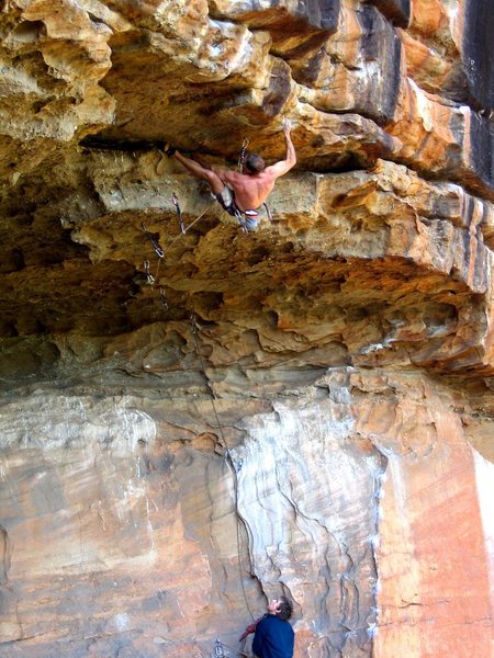 Simon Atkins cruising the 2nd ascent of Jugzilla (27 5,12d) at Thompsons Point. Nowra, NSW