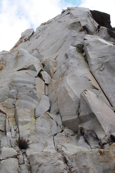 A look at the 2nd pitch of 'Crack Kingdom', just left of center, showing the short but stout crux off-width half-way up the photo. (Some guy rapping in the upper-right corner for some sort of scale)