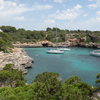 A scenic view of the cove of Cala Sa Nau.  The climbing is found on the unsheltered ocean side behind the photographer.