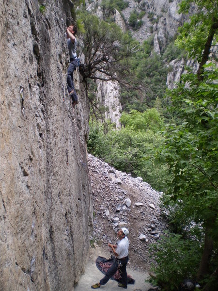 Looking for holds on <em>Monkey Bars</em>.<br>
<br>
(Jeff Jones belayed by Howard Chuntz)