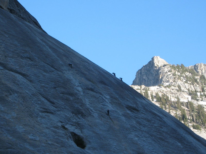 A team works on The Dike Route at the end of the day, while two free soloers are silhouetted on a line to their right.<br>
<br>
June 2009
