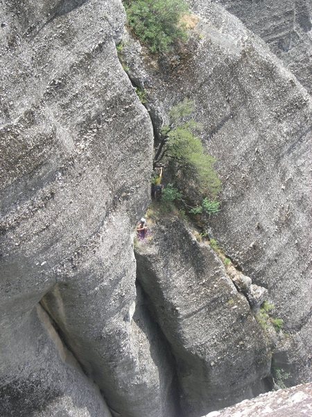 James starting up the third pitch which is really more of a scramble through trees and thorn bushes. Follow the line of the rope up to see the line of the route. Ippy belays him from the top of the second pitch. The second pitch comes up from the chimney below him.