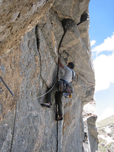 Rob Kepley sets up for the burly roof crux.