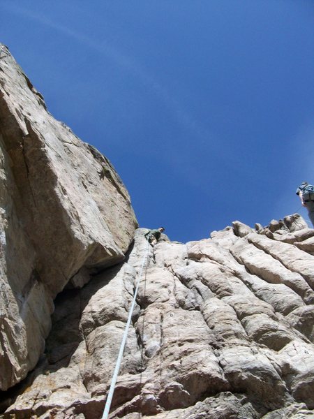 Jeremy reaches the top of Chasing Sticks.