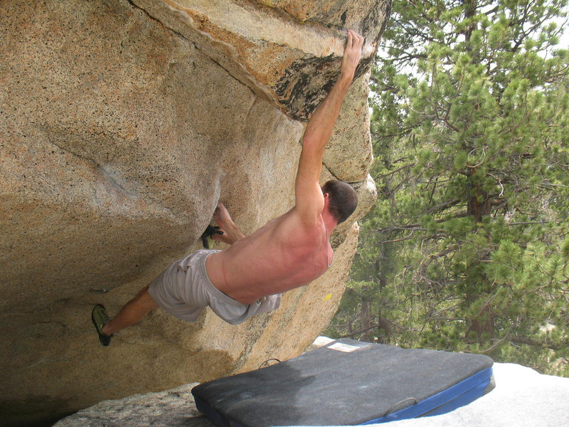 Starting the crux on The One (V6), Tramway
