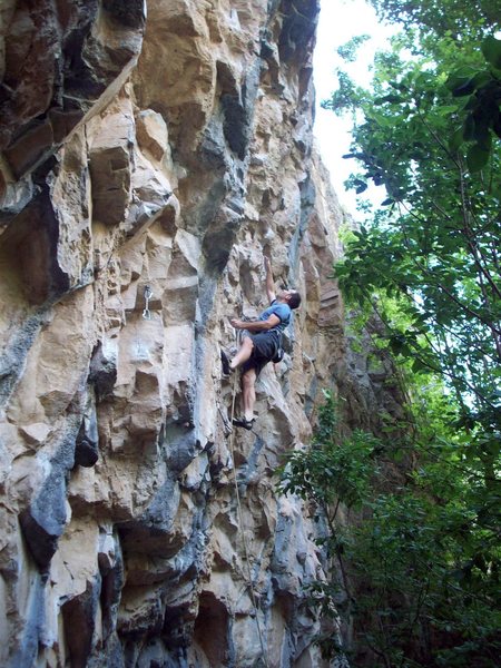 Just past the dynamic crux of Quick Draws, groping for a brief rest before the devious roof.