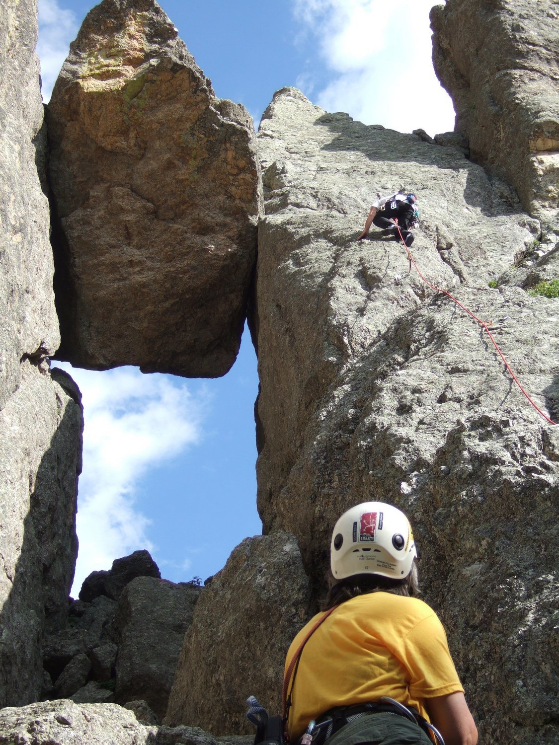 Lenore Sobota belaying Paul Huebner. The 1st anchors are just above and