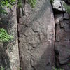 The inside corner is 5.5, the face is "Queen of Hearts" 5.10b. These are located to the east of "The Fang".
