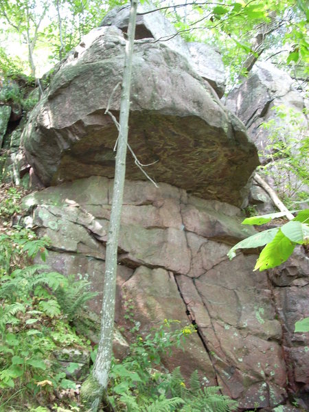 Overhang boulder problem a few yards north of "Turks Tooth" formation.