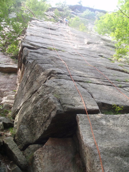 Ribless climbs the left face and arete. Ribs climbs the center of the block (up the rappel route).