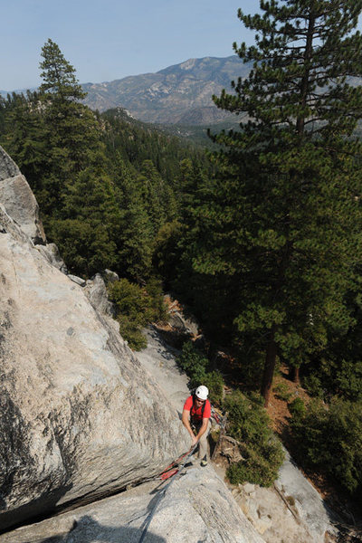 Jesse Groves negotiates a wide section near the top of the first pitch of Left Crack (5.8), Dome Rock.