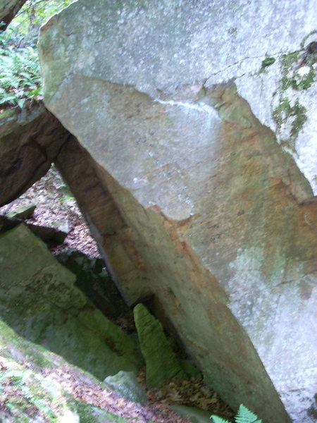 Hidden boulder in talus field south of the main climbs. Looks good!