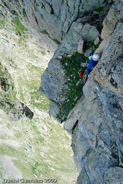 Thompson getting into the crux face on pitch 4.