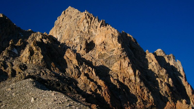 Just another photo of the Exum Ridge from the Lower Saddle. The Chockstone Chimney (pitch 1) can be seen near the bottom of the ridge at the sun/shade line between the main wall and the detached pinnacle.