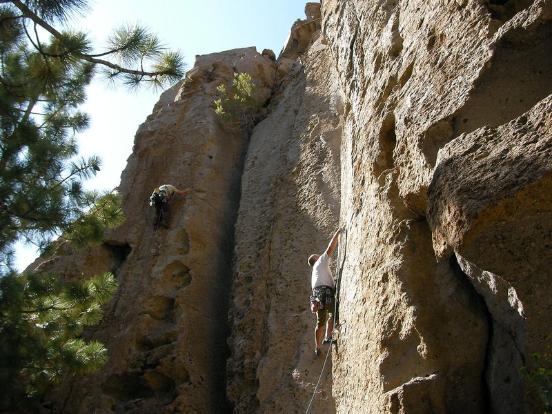 Kelly clipping the second bolt of Borrowing From Tradition, 10b and unknown climber on Digits Delight.