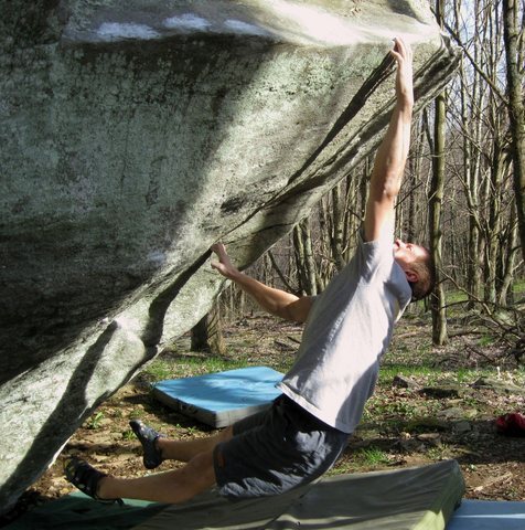 Shane Messer hitting the sloping lip of "O.A." (V-7), at the "Bones & A.V.P." area, Grayson Highlands State Park VA