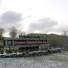 a snowy park welcome sign