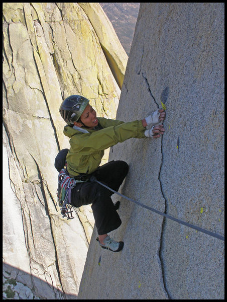 Angelina hand traversing on the thin flake near the end of Lost At Sea in The Needles.