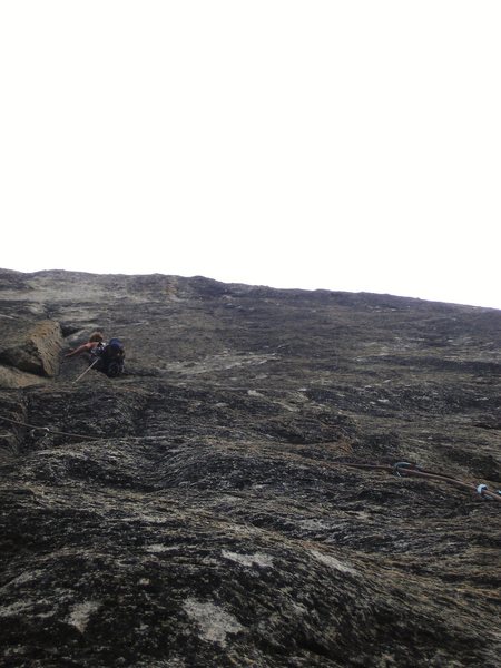 Climbing up the Golden corner of the second 10b pitch.