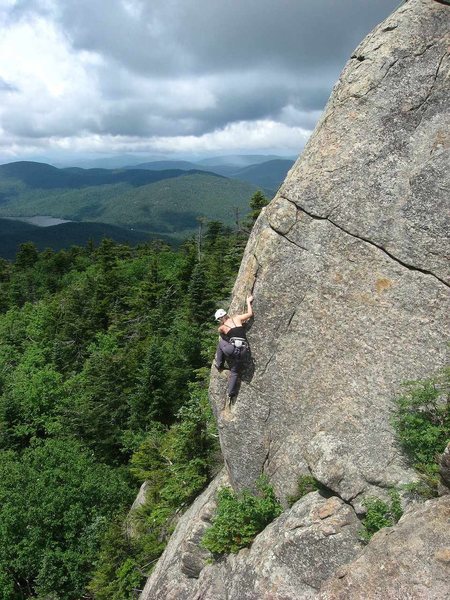 Climber works her way up Rock of Ages.