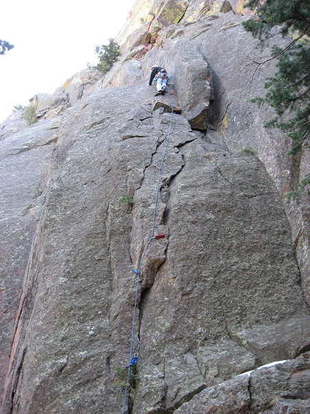 Moving through the crux of the 1st pitch.<br>
<br>
Photo by C. Treiber.