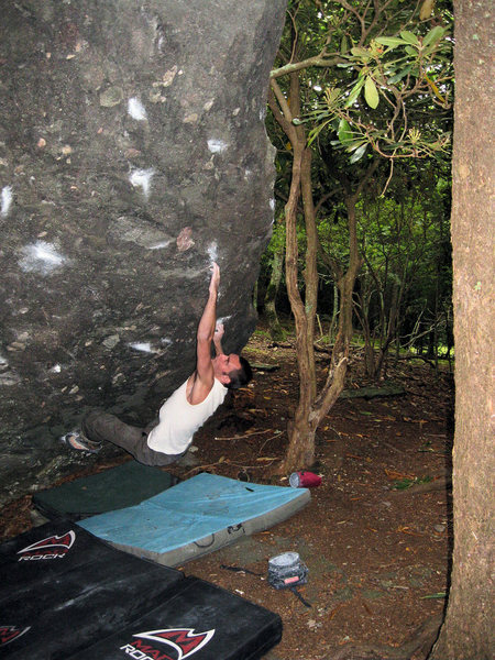 Steve Lovelace tossing off the phantom crimp on "Aftershock" (V-5?) at the Zeus Boulder, Olympus Area, Grayson Highlands State Park, VA