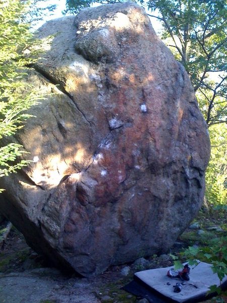 The other main boulder at the top of the Little Agassiz area. The V2 Face Problem starts on the jug on the lower left and follows the chalk to a slopey top out. The Right Arete is easier than it looks in this photo. <br>