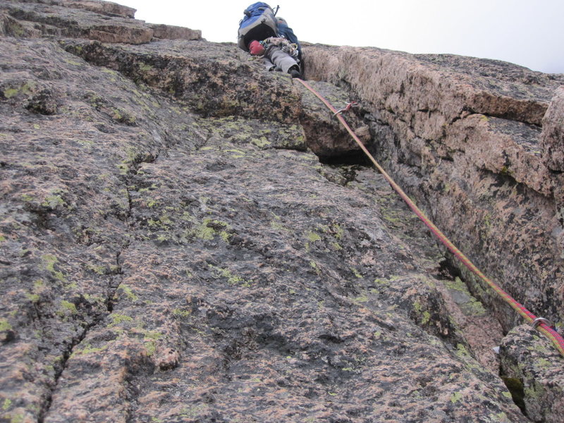 Climbing the shallow corner and bomber handcrack on P2.