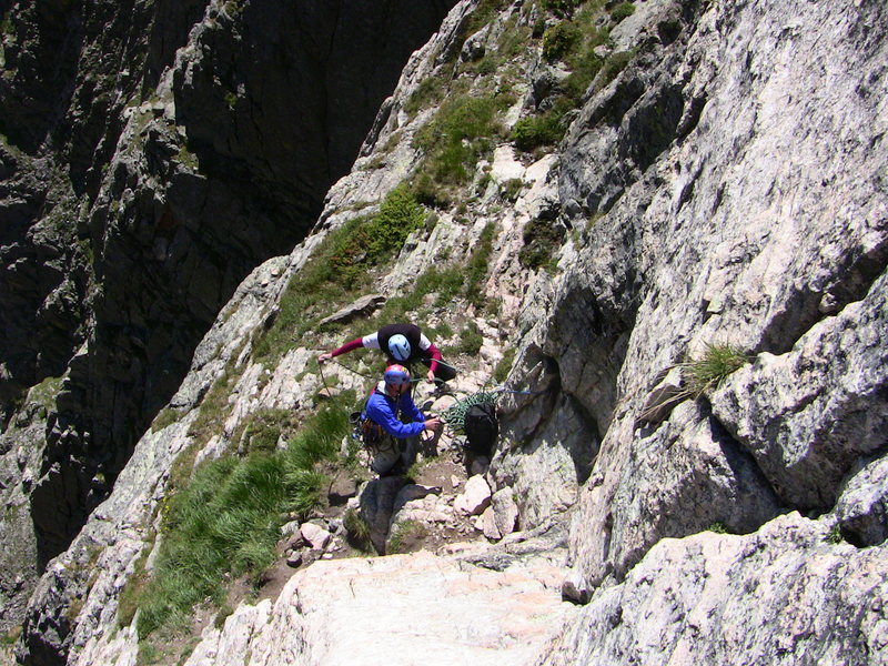 Clay and Alex back on route, enjoying the big ledge atop pitch 4.