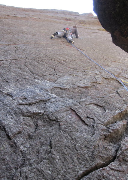 Wedging in a brass micro to protect the thin crux moves of Rip This Joint. Photo by Jesse Ramos.